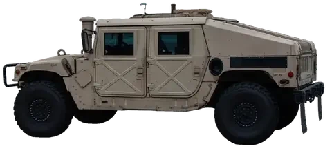 A tan M998 Humvee, side on, turning toward three-quarter front