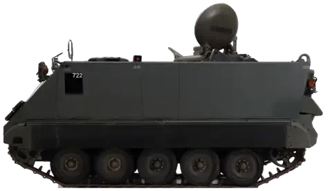 An M113 armored personnel carrier on tracks, side on, turning toward three-quarter front